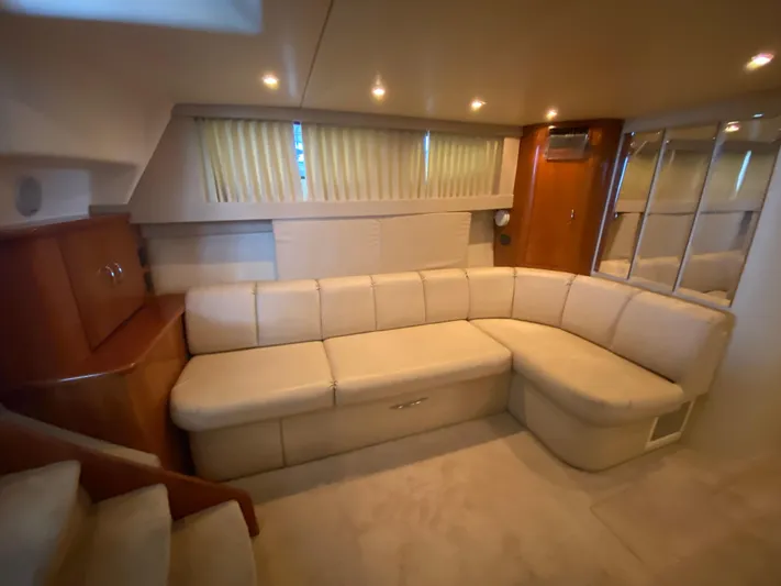  Yacht Photos Pics Luxurious interior of 2006 Carver 36 Mariner yacht with beige seating and wood accents.