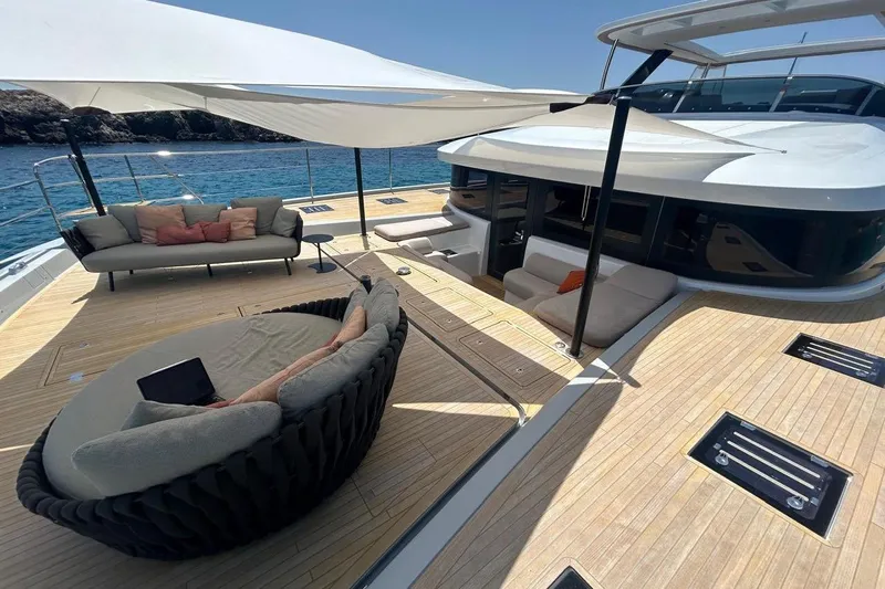 4ever Yacht Photos Pics Luxurious 2022 Lagoon 67 yacht deck with elegant seating and ocean view.