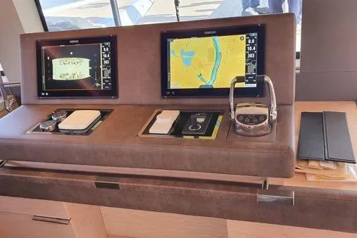 4ever Yacht Photos Pics Luxury Lagoon 67 yacht helm with dual navigation screens, 2022 model.