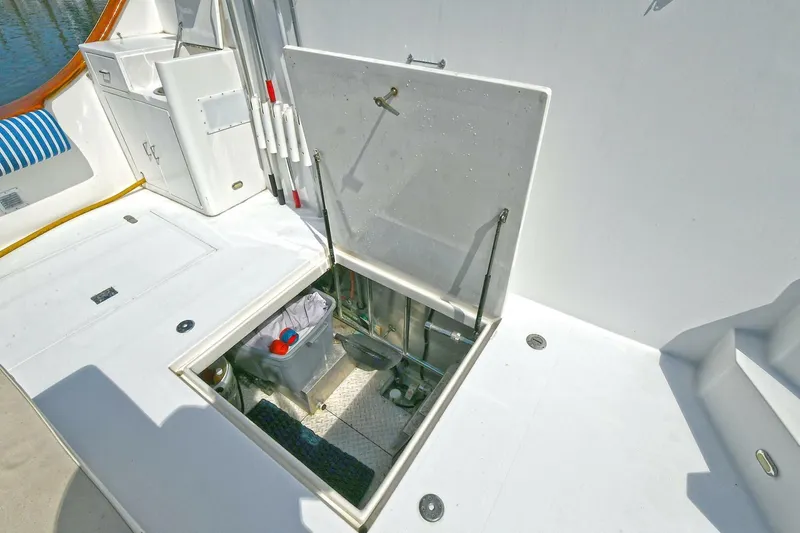 Symmetry Yacht Photos Pics Open hatch on 2002 Grand Alaskan Flushdeck yacht deck, revealing storage compartment.