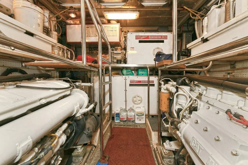 Symmetry Yacht Photos Pics Engine room of 2002 Grand Alaskan Flushdeck yacht, featuring machinery and equipment.