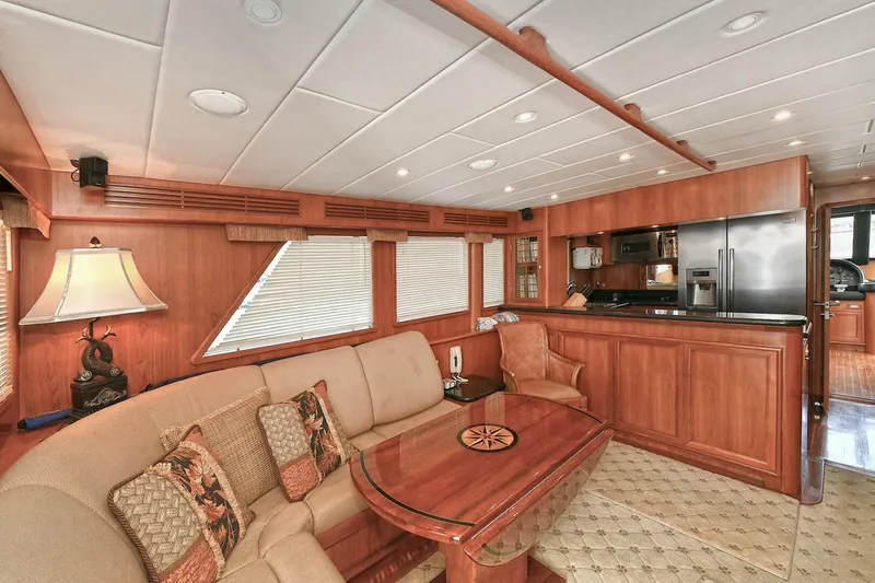 Symmetry Yacht Photos Pics Luxurious 2002 Grand Alaskan Flushdeck yacht interior with elegant wood finishes and modern amenities.