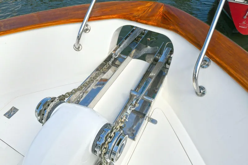 Symmetry Yacht Photos Pics Anchor system on 2002 Grand Alaskan Flushdeck yacht with polished metal and wooden trim.