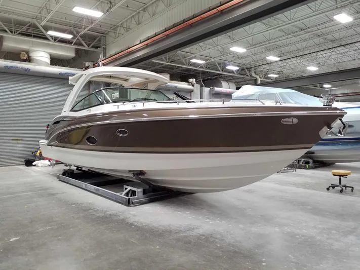  Yacht Photos Pics 2019 Formula 350 Crossover Bowrider OB in a showroom, side view.