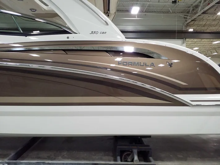  Yacht Photos Pics 2019 Formula 350 Crossover Bowrider OB, sleek brown and white design in a showroom.