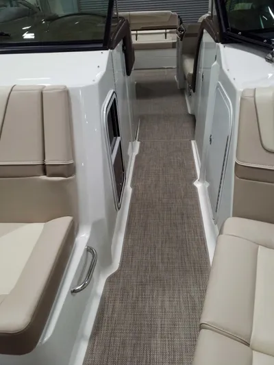  Yacht Photos Pics 2019 Formula 350 Crossover Bowrider OB interior with beige seating and carpeted walkway.