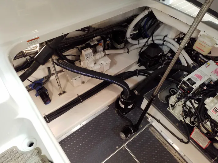 Yacht Photos Pics Engine compartment of a 2019 Formula 350 Crossover Bowrider OB, showcasing mechanical components.