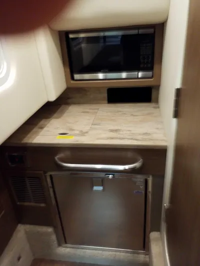  Yacht Photos Pics 2019 Formula 350 Crossover Bowrider OB interior kitchenette with microwave and mini-fridge.