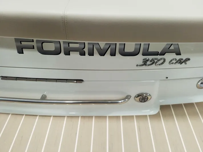  Yacht Photos Pics 2019 Formula 350 Crossover Bowrider OB boat rear view with logo and chrome details.