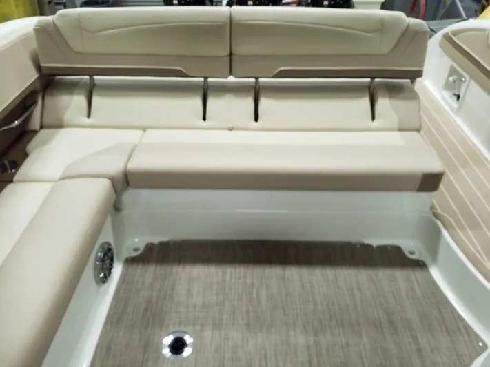  Yacht Photos Pics 2019 Formula 350 Crossover Bowrider OB interior with beige seating and carpeted flooring.