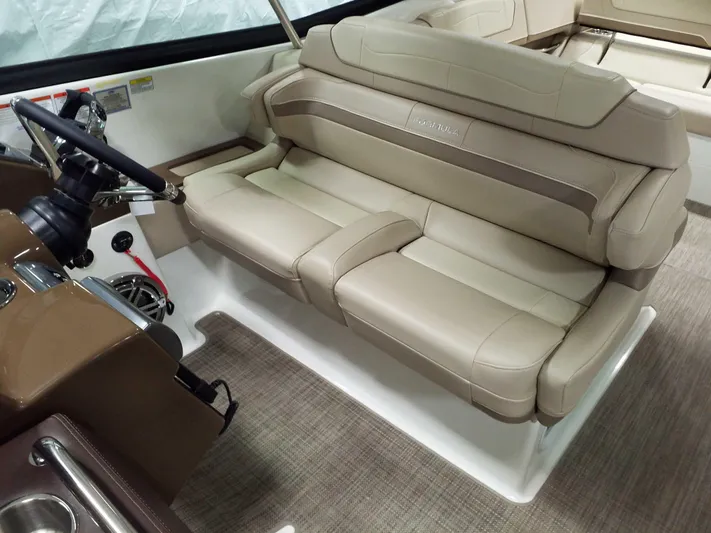  Yacht Photos Pics 2019 Formula 350 Crossover Bowrider OB interior with beige leather seating and steering wheel.