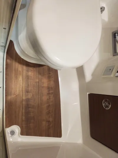  Yacht Photos Pics 2019 Formula 350 Crossover Bowrider OB bathroom with wooden flooring and modern fixtures.
