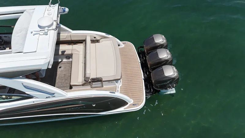  Yacht Photos Pics 2019 Formula 350 Crossover Bowrider OB with triple Mercury outboard engines on clear water.