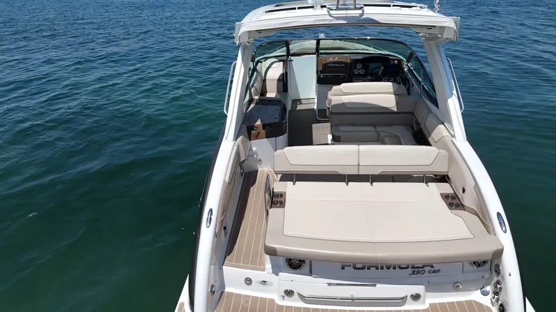  Yacht Photos Pics 2019 Formula 350 Crossover Bowrider OB on calm water, showcasing spacious seating and sleek design.