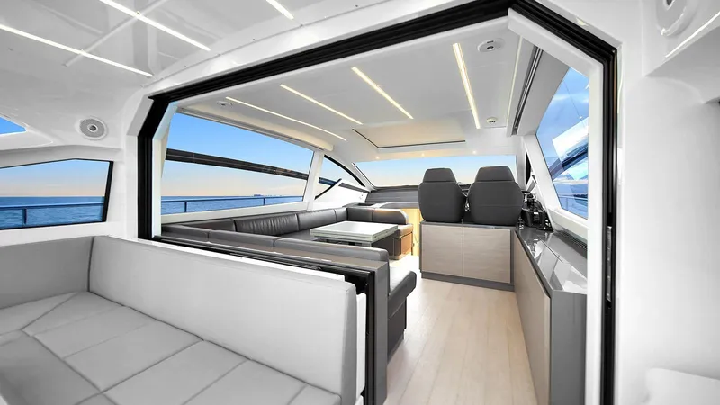  Yacht Photos Pics Luxurious interior of 2020 Pershing 62 yacht with modern seating and ocean view.
