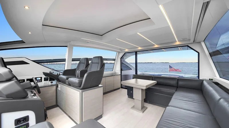  Yacht Photos Pics Luxurious interior of 2020 Pershing 62 yacht with modern seating and ocean view.