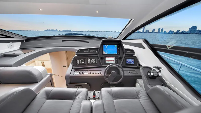  Yacht Photos Pics Luxurious 2020 Pershing 62 yacht cockpit with modern navigation system and panoramic ocean view.