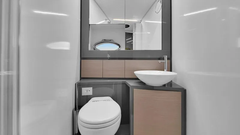  Yacht Photos Pics Modern bathroom interior on 2020 Pershing 62 yacht, featuring sleek design and fixtures.