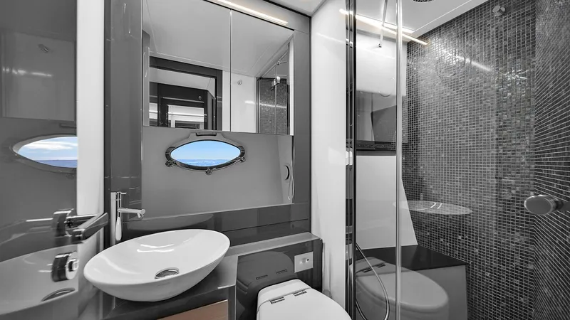  Yacht Photos Pics Luxurious bathroom in 2020 Pershing 62 yacht with modern fixtures and ocean view.
