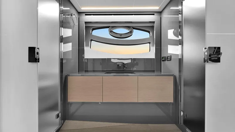  Yacht Photos Pics Modern bathroom interior on 2020 Pershing 62 yacht, featuring sleek design and large window.