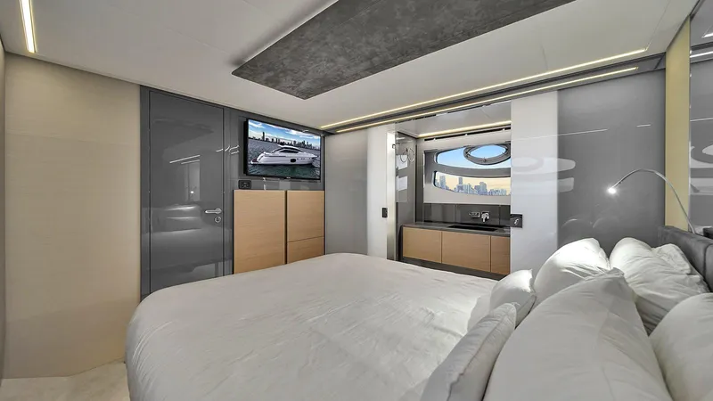  Yacht Photos Pics Luxurious bedroom interior of 2020 Pershing 62 yacht with modern design and amenities.