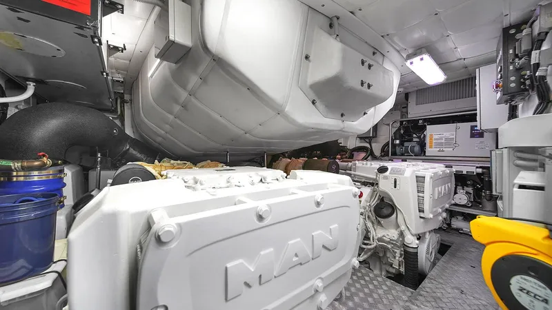  Yacht Photos Pics Engine room of a 2020 Pershing 62 yacht featuring MAN engines.