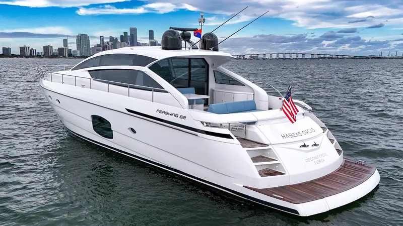 Yacht Photos Pics Luxury 2020 Pershing 62 yacht cruising near city skyline.