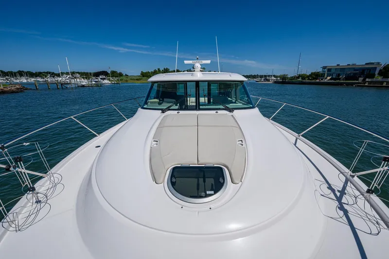  Yacht Photos Pics 2020 Tiara Yachts C44 Coupe on water, showcasing sleek design and spacious deck.