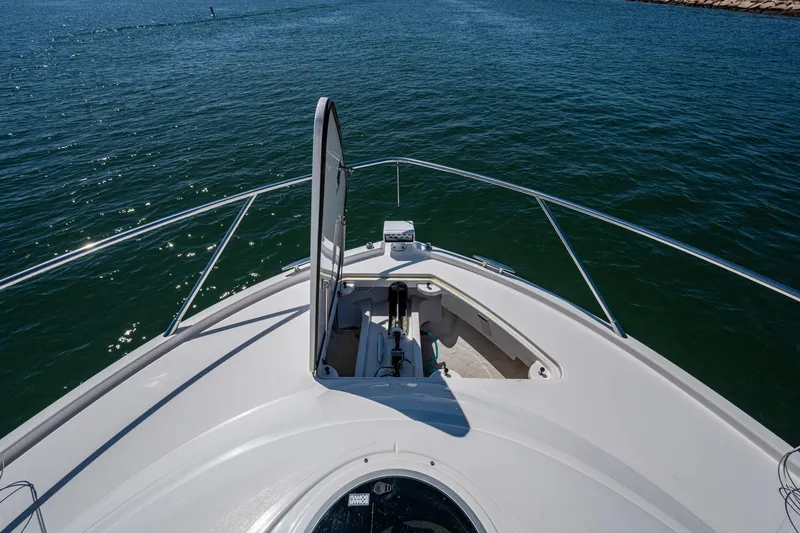  Yacht Photos Pics Bow view of 2020 Tiara Yachts C44 Coupe on open water.