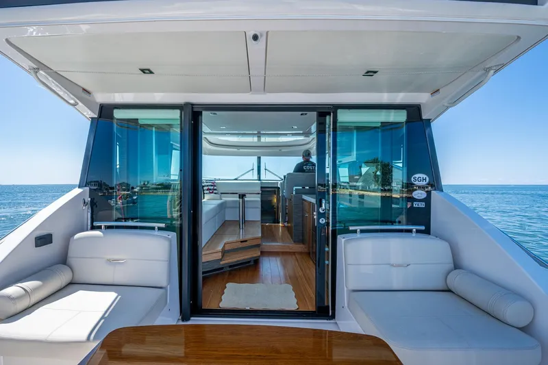  Yacht Photos Pics 2020 Tiara Yachts C44 Coupe interior with ocean view, featuring luxurious seating and modern design.