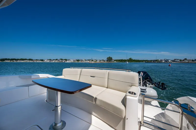  Yacht Photos Pics 2020 Tiara Yachts C44 Coupe, featuring elegant seating and scenic water views.