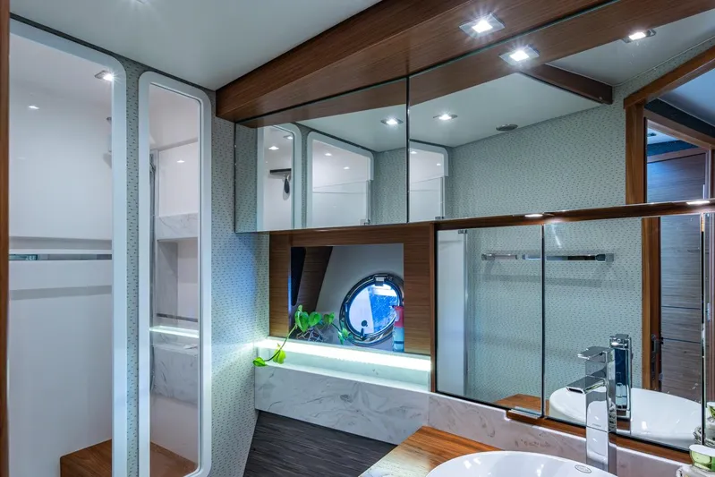  Yacht Photos Pics Luxurious bathroom interior of 2020 Tiara Yachts C44 Coupe with modern fixtures and elegant design.