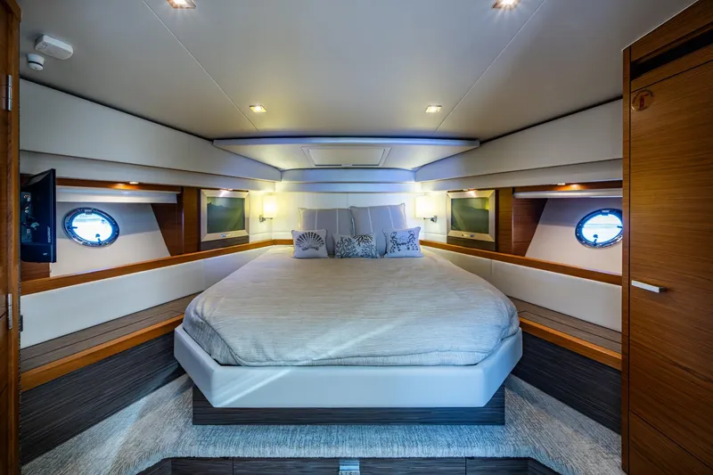  Yacht Photos Pics Luxurious 2020 Tiara Yachts C44 Coupe bedroom with elegant design and modern amenities.
