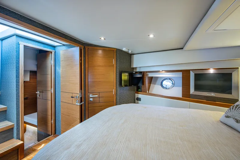  Yacht Photos Pics Luxurious interior of 2020 Tiara Yachts C44 Coupe with wood finishes and modern amenities.