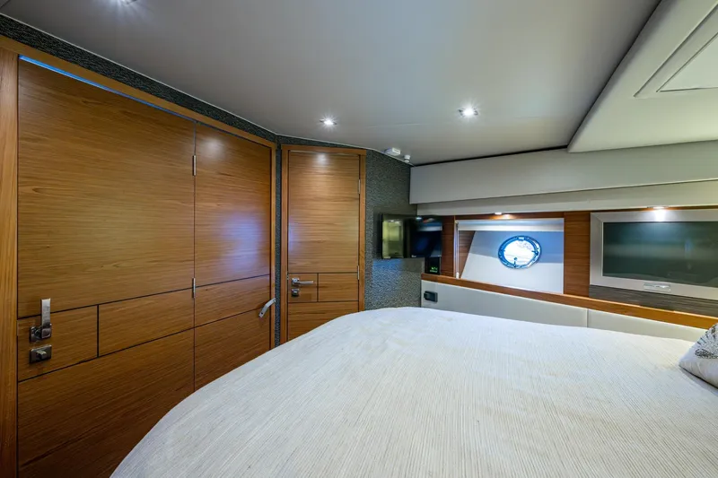  Yacht Photos Pics Luxurious interior of 2020 Tiara Yachts C44 Coupe with wood paneling and modern amenities.