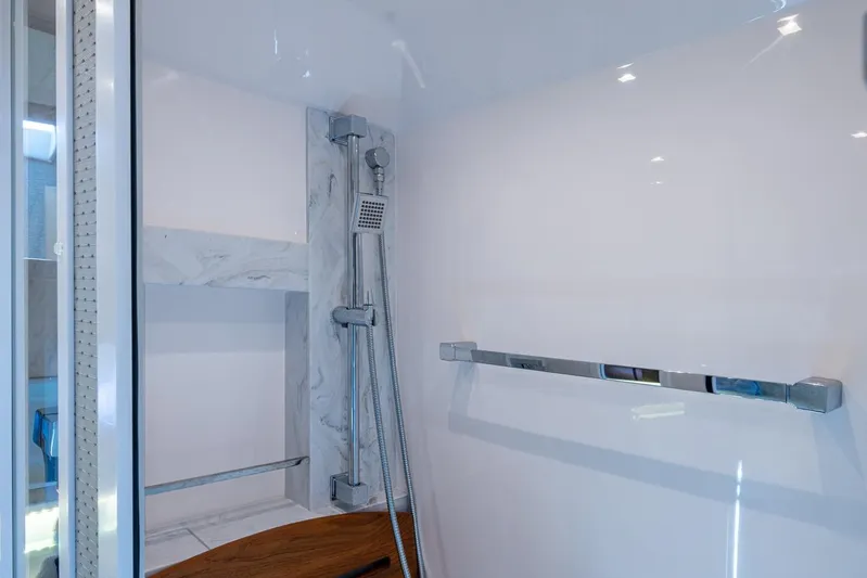  Yacht Photos Pics Luxurious shower area in 2020 Tiara Yachts C44 Coupe, featuring modern fixtures and sleek design.
