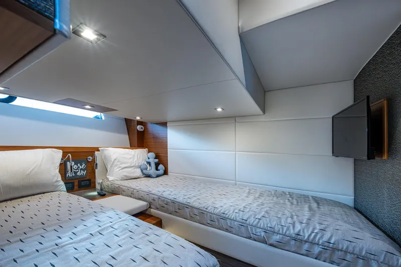  Yacht Photos Pics Luxurious 2020 Tiara Yachts C44 Coupe cabin with twin beds and modern decor.