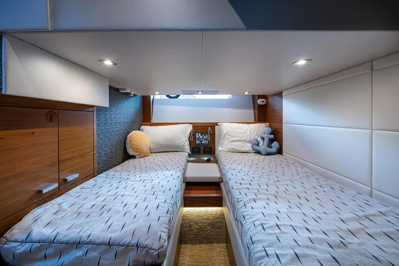  Yacht Photos Pics 2020 Tiara Yachts C44 Coupe cabin with twin beds and nautical decor.