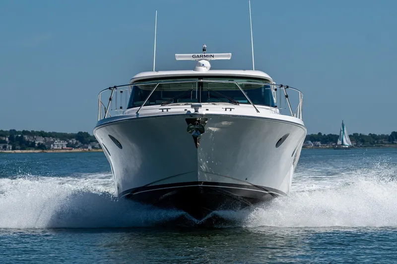  Yacht Photos Pics 2020 Tiara Yachts C44 Coupe cruising on open water, front view.
