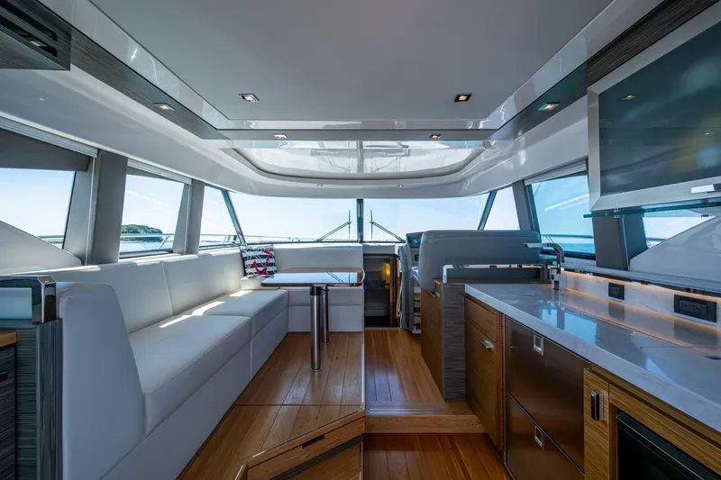  Yacht Photos Pics Luxurious interior of 2020 Tiara Yachts C44 Coupe with modern design and panoramic windows.