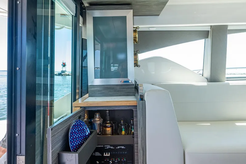  Yacht Photos Pics Interior of 2020 Tiara Yachts C44 Coupe with bar and seating area.