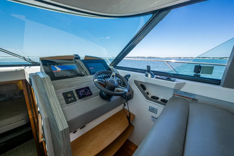 Yacht Photos Pics 2020 Tiara Yachts C44 Coupe helm with modern navigation systems and panoramic sea view.