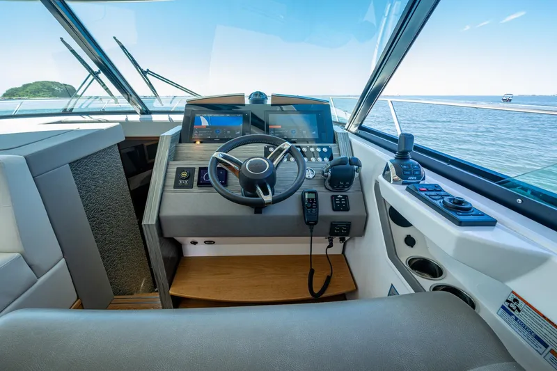  Yacht Photos Pics 2020 Tiara Yachts C44 Coupe helm with modern controls and ocean view.