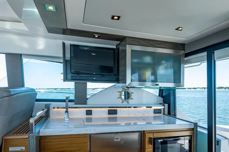 Yacht Photos Pics Interior of 2020 Tiara Yachts C44 Coupe with modern kitchen and ocean view.