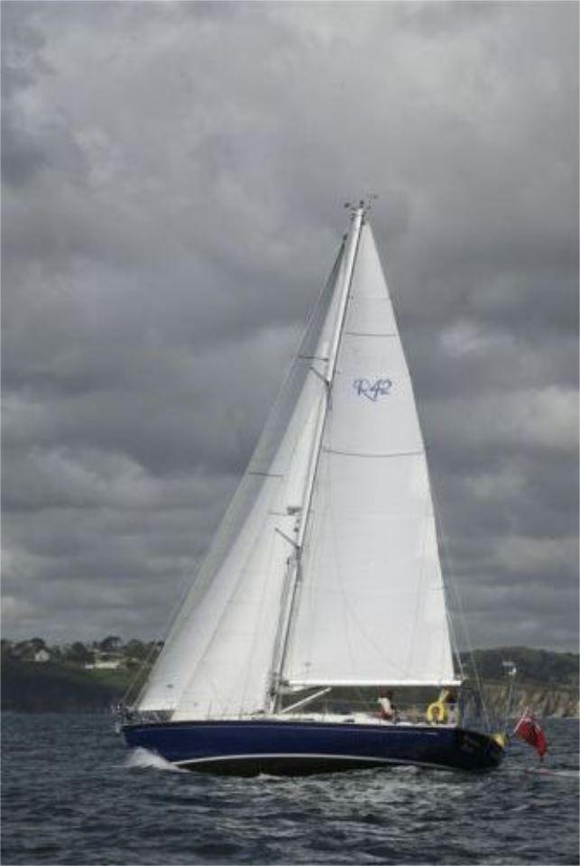 Sailing yacht Rustler 42, 2025 model, navigating under cloudy skies.