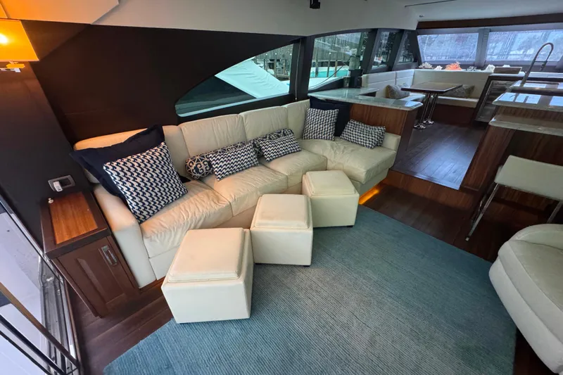 Elsewhere Yacht Photos Pics Luxurious interior of 2013 Hatteras 60 Motor Yacht with elegant seating and modern decor.