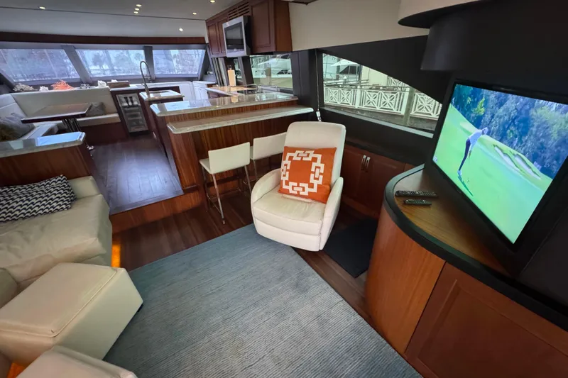 Elsewhere Yacht Photos Pics Luxurious interior of 2013 Hatteras 60 Motor Yacht with modern furnishings and entertainment system.