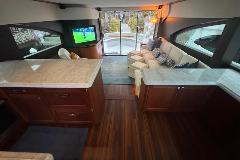 Elsewhere Yacht Photos Pics Luxurious interior of 2013 Hatteras 60 Motor Yacht with elegant seating and modern amenities.