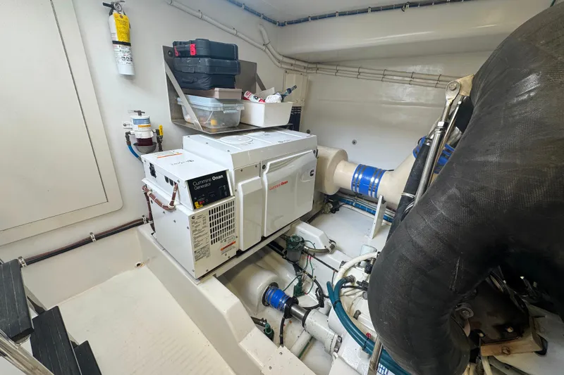 Elsewhere Yacht Photos Pics Engine room of 2013 Hatteras 60 Motor Yacht with Cummins Onan generator.