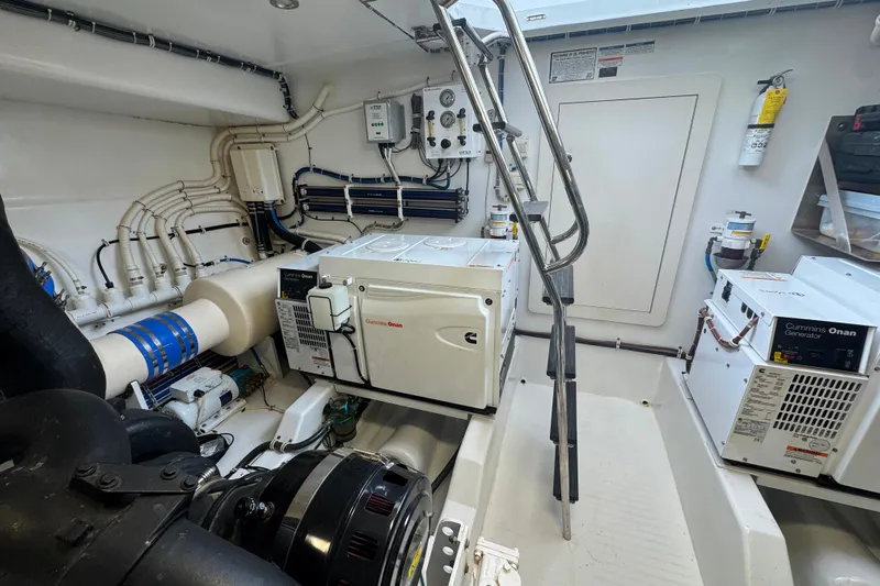 Elsewhere Yacht Photos Pics Engine room of 2013 Hatteras 60 Motor Yacht with Cummins Onan generators and control panels.